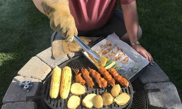 The author is in his permanent camping spot—by the grill.