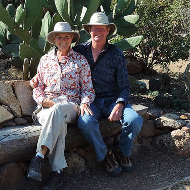 Kevin and Ruth Read sitting in front of a cactus in Mexico