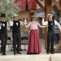 A group in period costume performing in the Platzl in Kimberley, B.C.