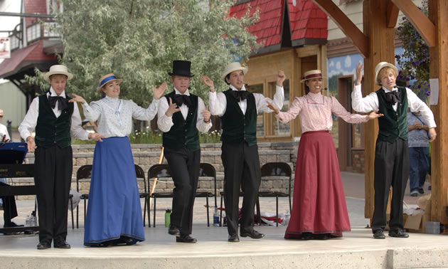 A group in period costume performing in the Platzl in Kimberley, B.C.