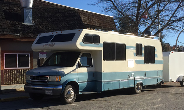 Laze Daze motorhome, parked on street.