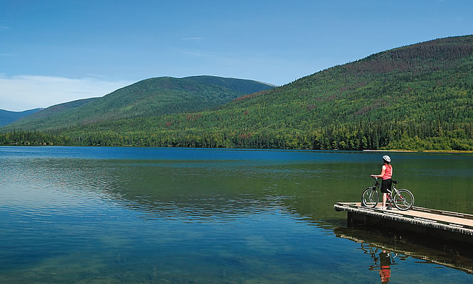 person on a dock riding their bike