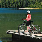 person on a dock riding their bike