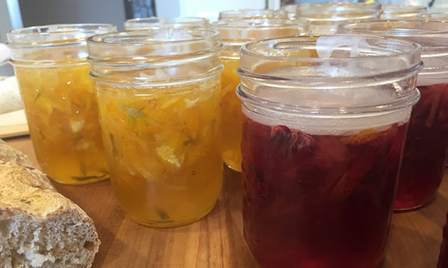 Blood orange marmalade is overlain with a paraffin top.