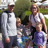 Smiling couple with two young girls