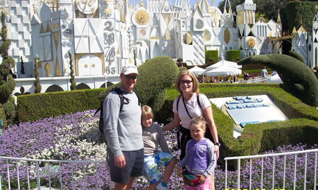 Smiling couple with two young girls