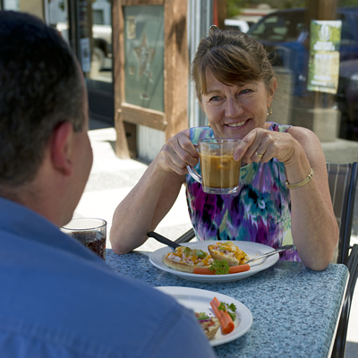 A woman drinking coffee outside a Merritt, B.C. cafe.