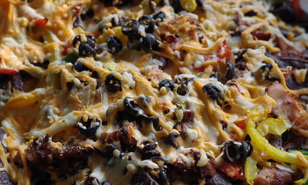 RV oven-broiled nachos are like taking the night off from campfire cooking.
