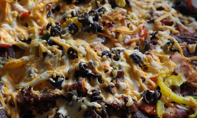 RV oven-broiled nachos are like taking the night off from campfire cooking.
