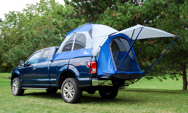 The Truck Tent in action on the back of a navy truck.