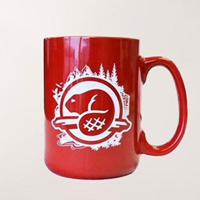 Red mug with Parks Canada logo and graphic of beaver. 