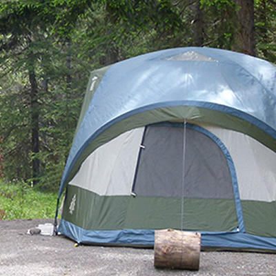 Picture of tent and picnic bench at campsite. 