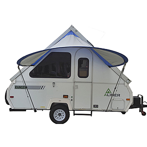 A framed towable trailer with the PahaQue Visor open and installed providing shelter from the rain and protection from the sun