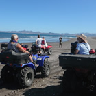 Sea and sky make a beautiful backdrop for quad riders on the beach