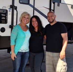 Johnnie Walker RV Salesperson Shawna Fitch  with customers Cesareo and Janette Razo.