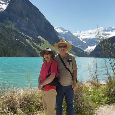 Ralph and Donna standing in front of a beautiful mountain vista