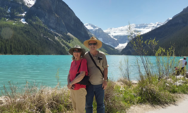 Ralph and Donna standing in front of a beautiful mountain vista