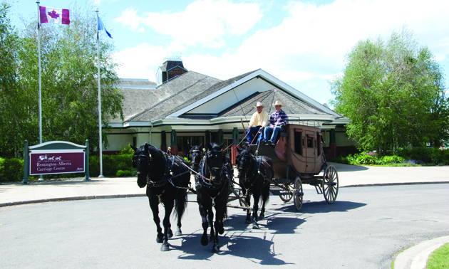 an old-fashioned carriage drawn by a team of two horses 