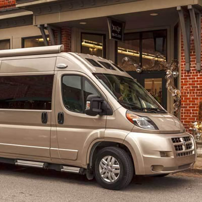 Roadtrek Zion parked at curb. 