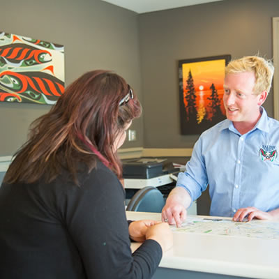 Manager and customer talking at Salish Seaside RV Haven. 