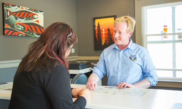 Manager and customer talking at Salish Seaside RV Haven. 