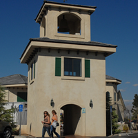 White, three-storey tower with an arched entrance