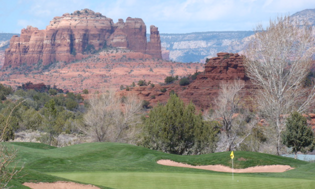 Desert rock formation and golf green