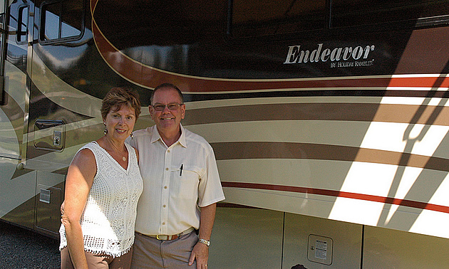 A couple beside their RV