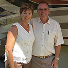 A couple beside their RV