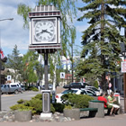 Smithers alpine Main Street includes red paved sidewalks, a large alpine clock and greenery.