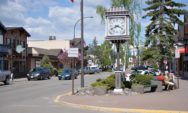 Smithers alpine Main Street includes red paved sidewalks, a large alpine clock and greenery.