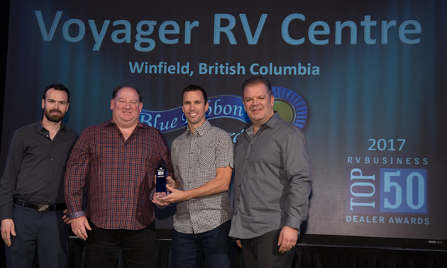 Voyager RV managers receive industry recognition: (L to R)  Logan Walker, Ward Fraser, Jason Friesen (vice-president) and Mike Roberts.