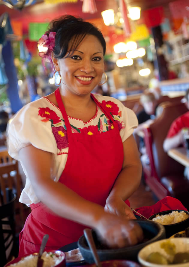 A woman making some traditional Mexican food in Tucson, Arizona.