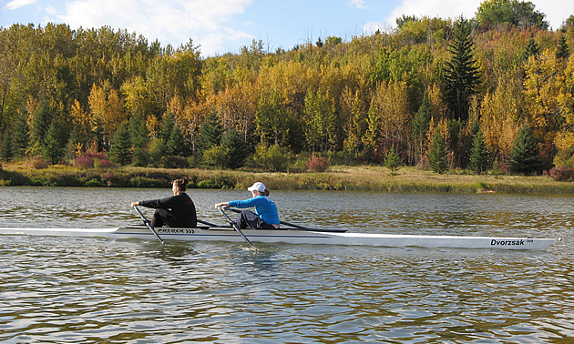Two women rowing a boat through Vermilion.