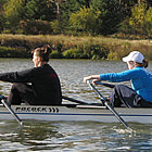 Two women rowing a boat through Vermilion.