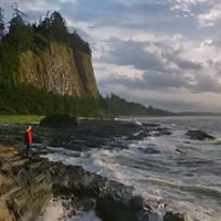 women standing on the seashore