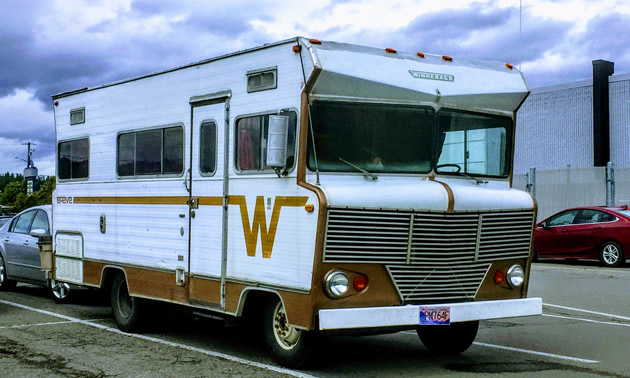 Winnebago Brave parked in parking lot. 