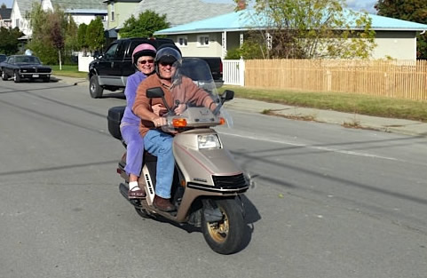 Stefan Sykut and Sharone O'Brien ride a 1980s Honda scooter.