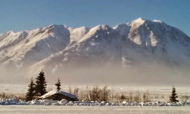 The sun shines on the mountains of Kluane National Park, Yukon