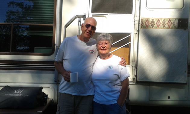 Jim and Marianne Ziegler standing in front of their RV