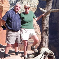 Senior couple on a hiking trail among cliffs