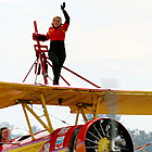 person standing on top of an aircraft at the Abbotsford Air Show