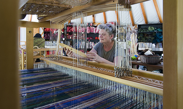 lady at a loom making crafts at Madeira park, BC