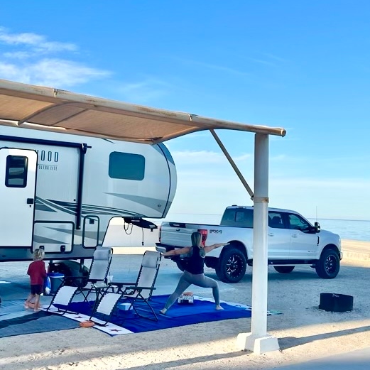 The Itchy Feet Fam together on a beach