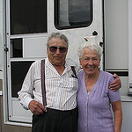 elderly couple in front of a motorhome