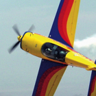 A aerobatic airplanes twists through the air.
