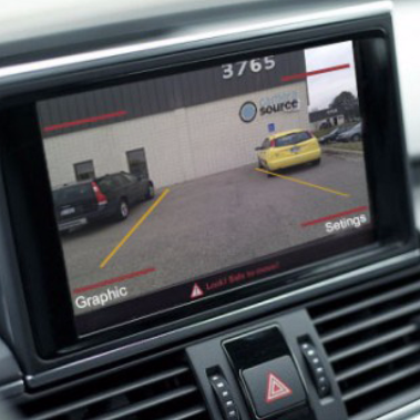 A backup camera mounted on a dashboard 