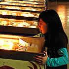 Girl playing on a pinball machine