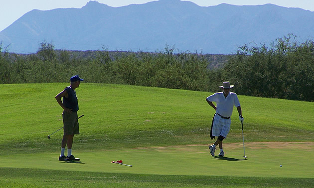 two men golfing