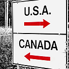 sign with USA and Canada with arrows pointing each way